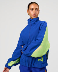 Woman wearing Hype Oversized Track Jacket - Electric Indigo | Model:Brylee | Size:XS | Thumbnail Index: 7