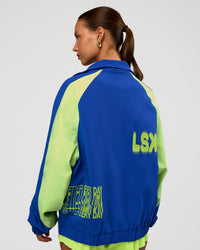 Woman wearing Hype Oversized Track Jacket - Electric Indigo | Model:Brylee | Size:XS | Thumbnail Index: 3