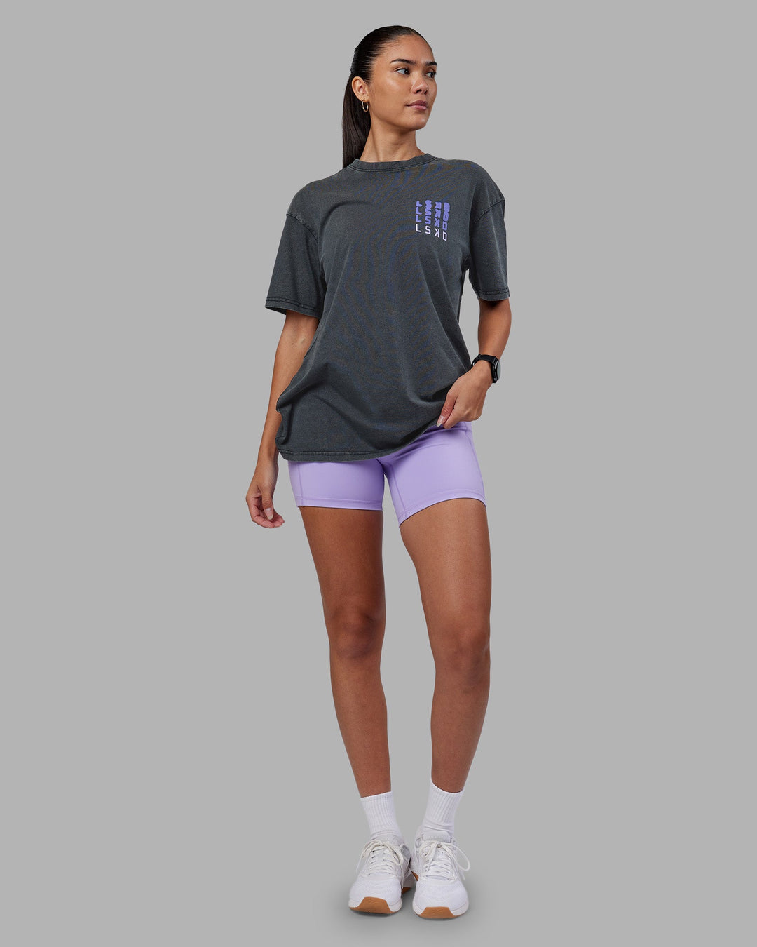 Woman wearing Inferno Journey FLXCotton Oversized Tee - Black Washed-Violet Ray | Model:Rhiley | Size:XS