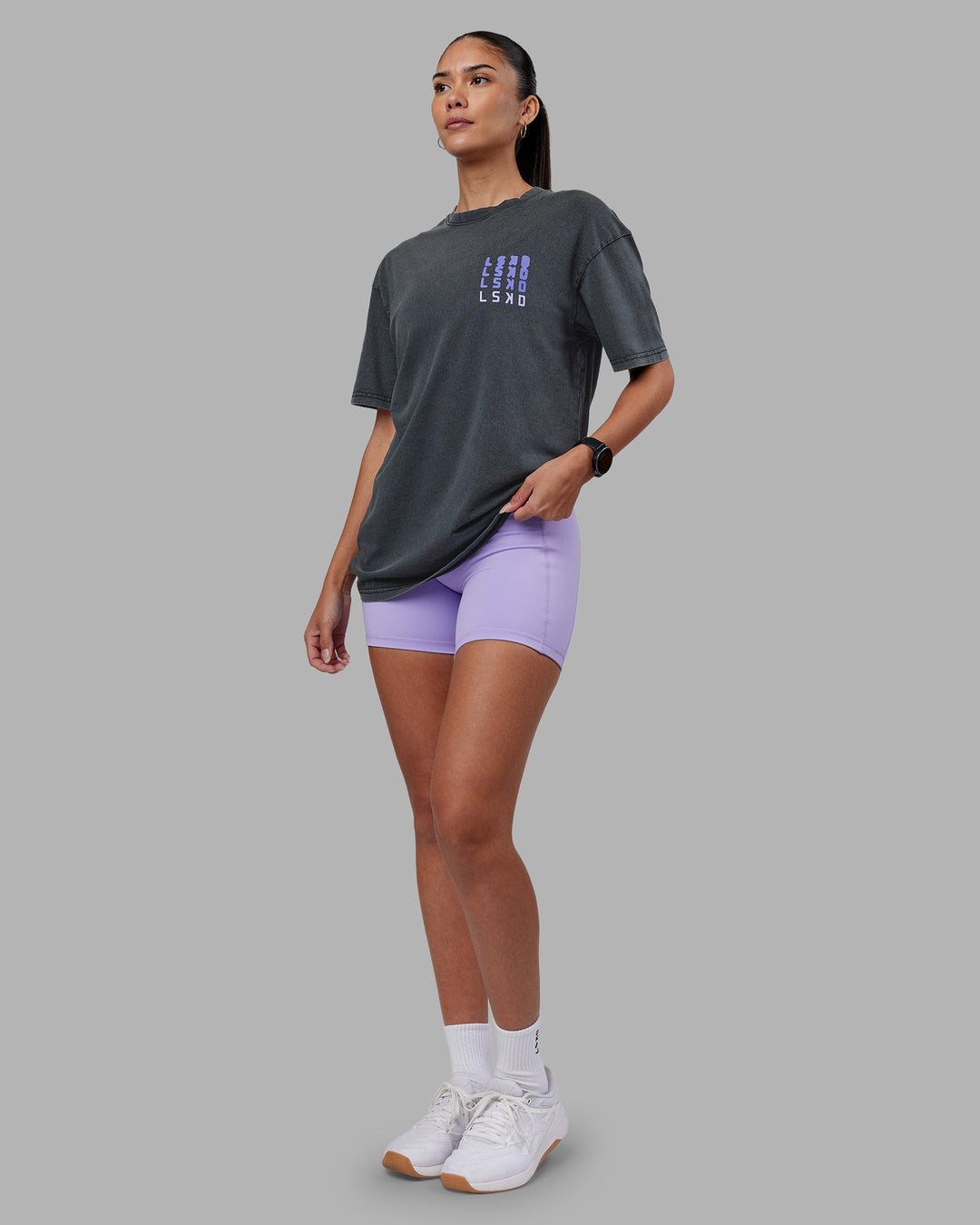 Woman wearing Inferno Journey FLXCotton Oversized Tee - Black Washed-Violet Ray | Model:Rhiley | Size:XS