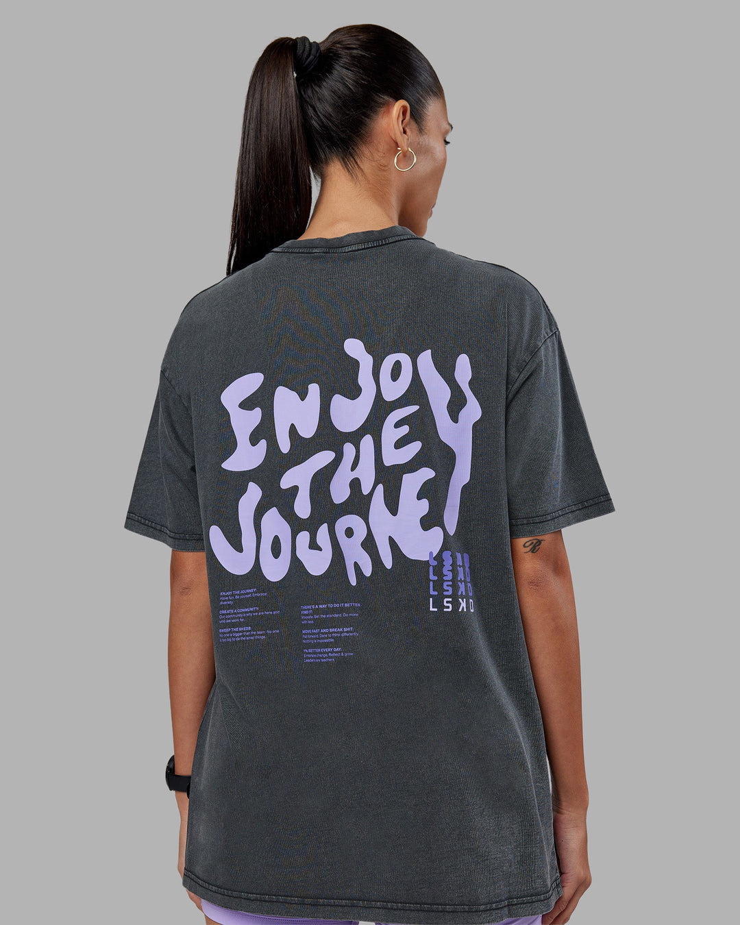 Woman wearing Inferno Journey FLXCotton Oversized Tee - Black Washed-Violet Ray | Model:Rhiley | Size:XS