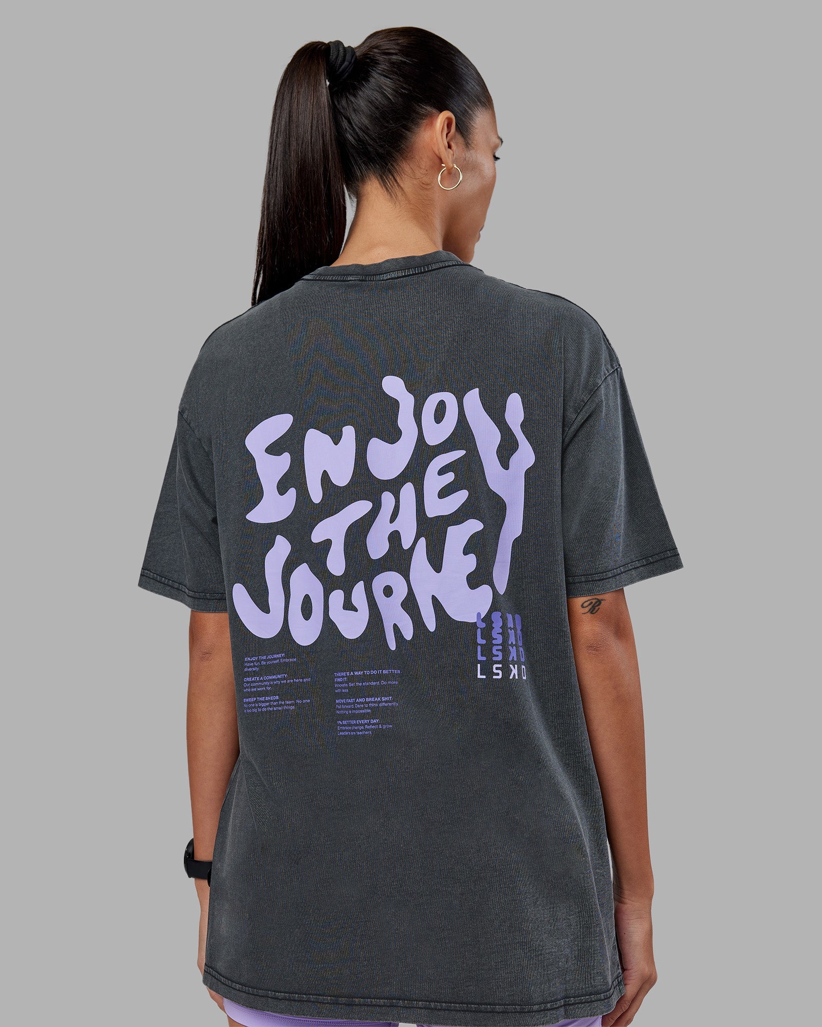 Woman wearing Inferno Journey FLXCotton Oversized Tee - Black Washed-Violet Ray | Model:Rhiley | Size:XS