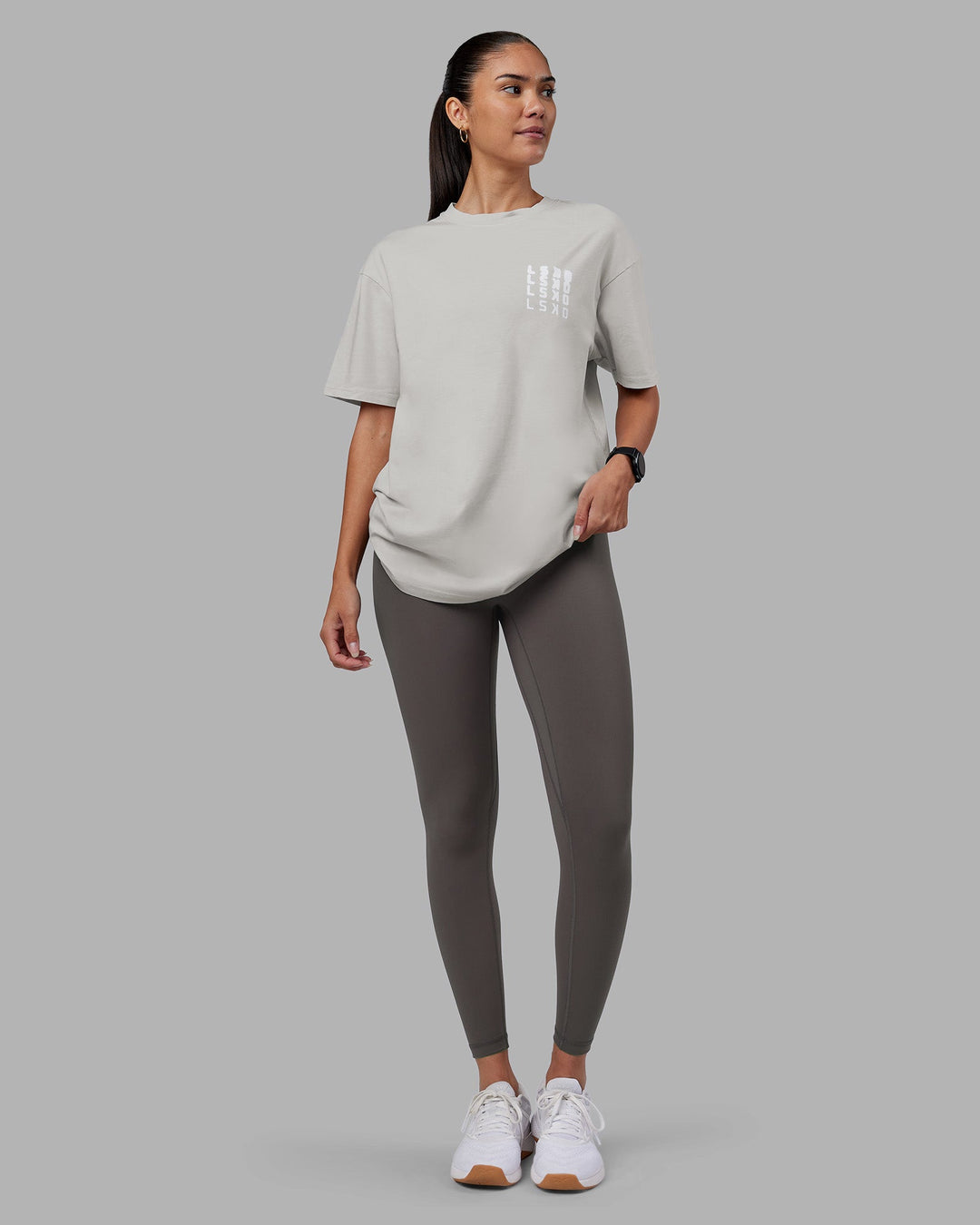 Woman wearing Inferno Journey FLXCotton Oversized Tee - Digital Mist Washed-White | Model:Rhiley | Size:XS
