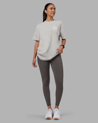 Woman wearing Inferno Journey FLXCotton Oversized Tee - Digital Mist Washed-White | Model:Rhiley | Size:XS