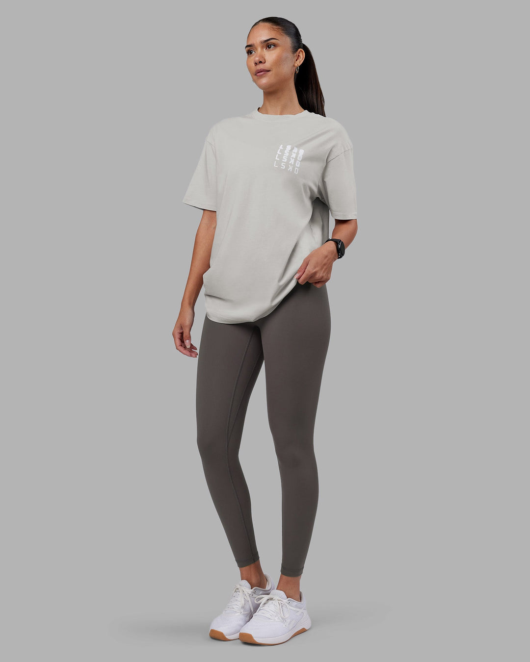 Woman wearing Inferno Journey FLXCotton Oversized Tee - Digital Mist Washed-White | Model:Rhiley | Size:XS