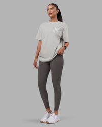 Woman wearing Inferno Journey FLXCotton Oversized Tee - Digital Mist Washed-White | Model:Rhiley | Size:XS