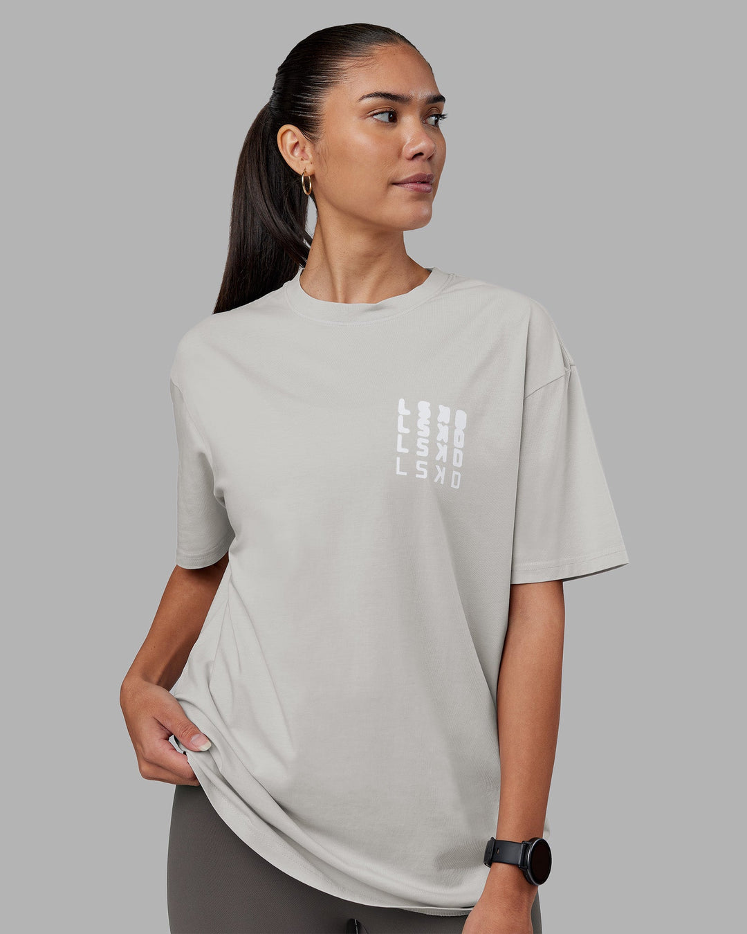 Woman wearing Inferno Journey FLXCotton Oversized Tee - Digital Mist Washed-White | Model:Rhiley | Size:XS