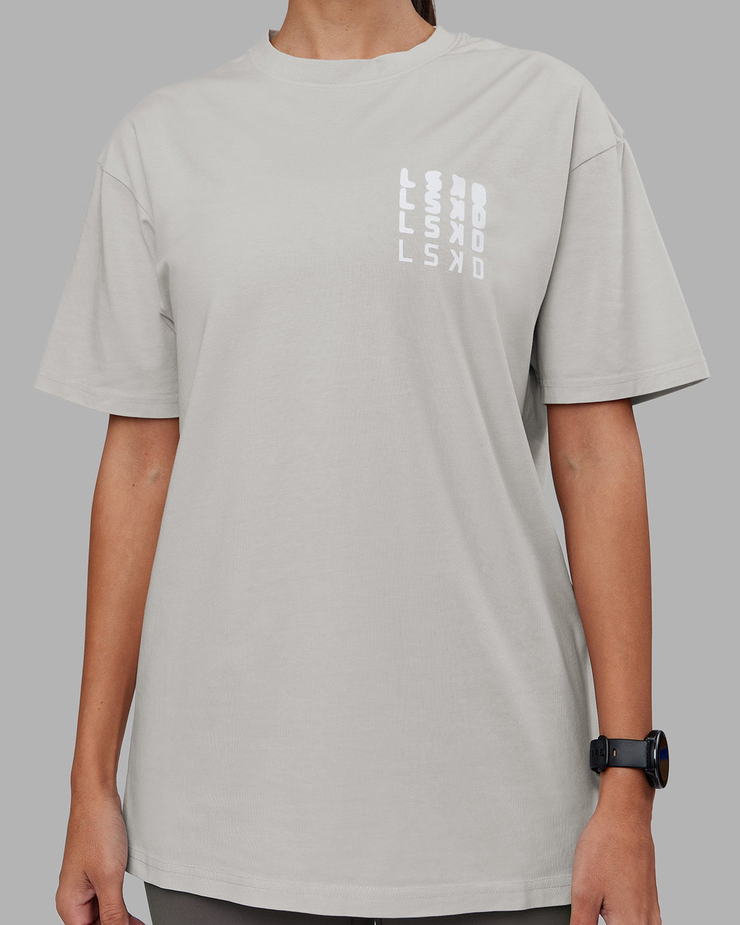 Woman wearing Inferno Journey FLXCotton Oversized Tee - Digital Mist Washed-White | Model:Rhiley | Size:XS