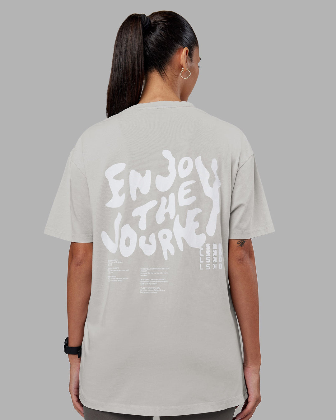 Woman wearing Inferno Journey FLXCotton Oversized Tee - Digital Mist Washed-White | Model:Rhiley | Size:XS