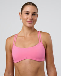 Woman wearing Interstellar Sports Bra - Candy Pink | Model:Emelia | Size:XS