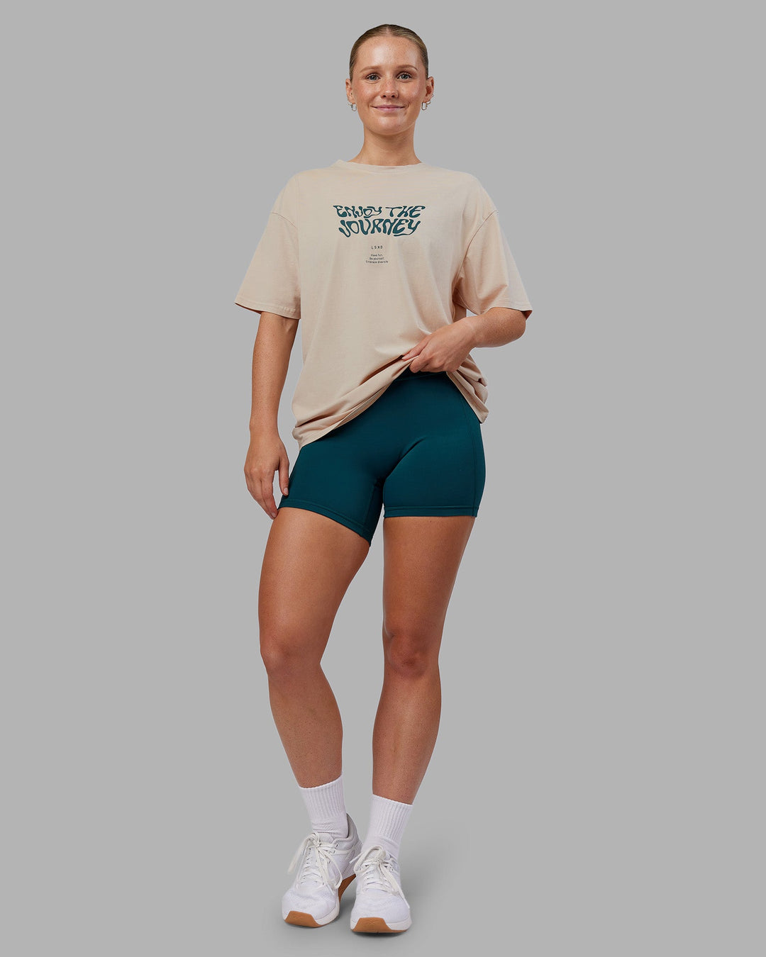 Woman wearing Journey FLXCotton Oversized Tee - Washed Shale Beige-Dark Moss| Model:Neve | Size:XS