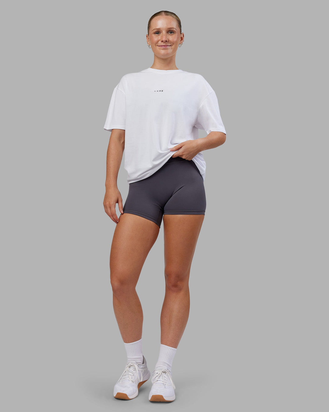 Woman wearing Kettlebell FLXCotton Oversized Tee - White-Black | Model:Neve | Size:XS