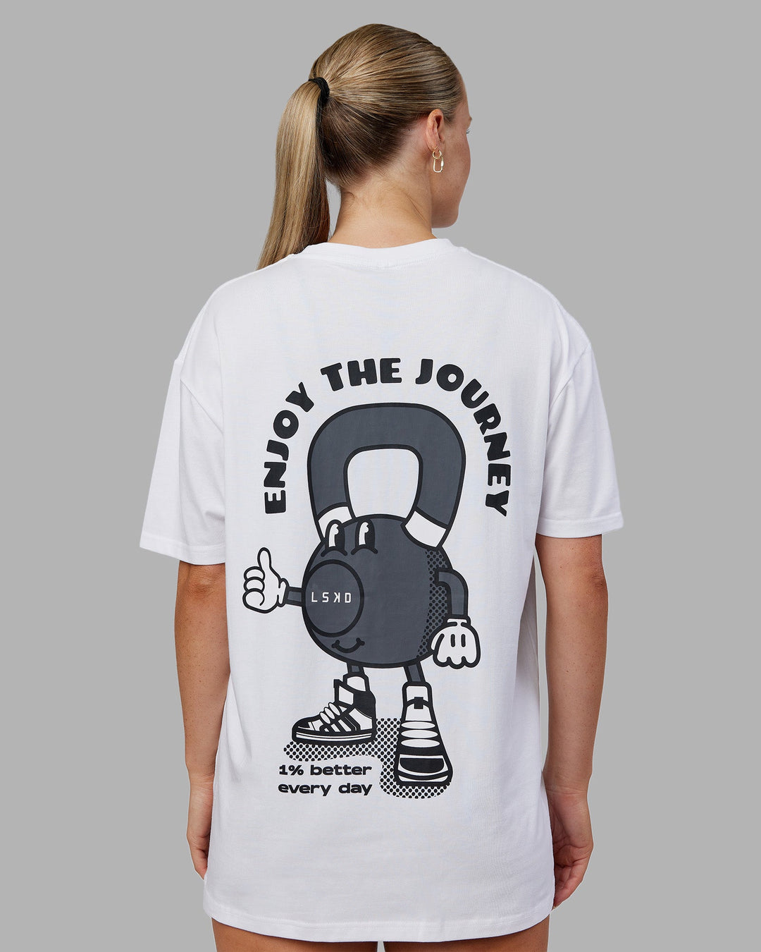 Woman wearing Kettlebell FLXCotton Oversized Tee - White-Black | Model:Neve | Size:XS