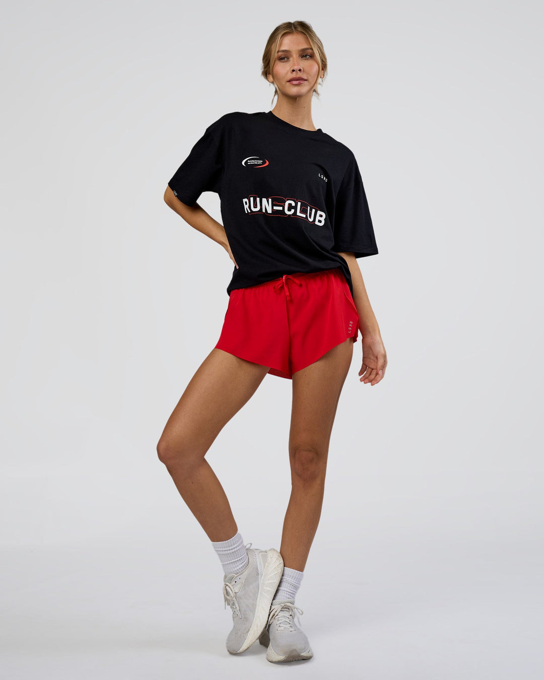 Woman wearing LSKD Run Club FLXCotton Oversized Tee - Black-White | Model:Leilani | Size:XS