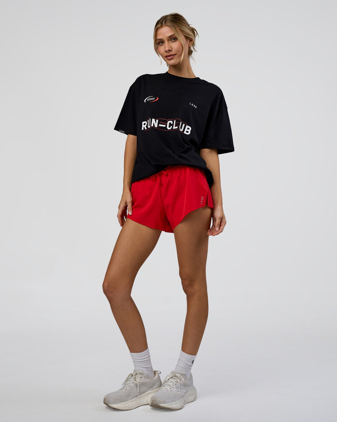 Woman wearing LSKD Run Club FLXCotton Oversized Tee - Black-White | Model:Leilani | Size:XS