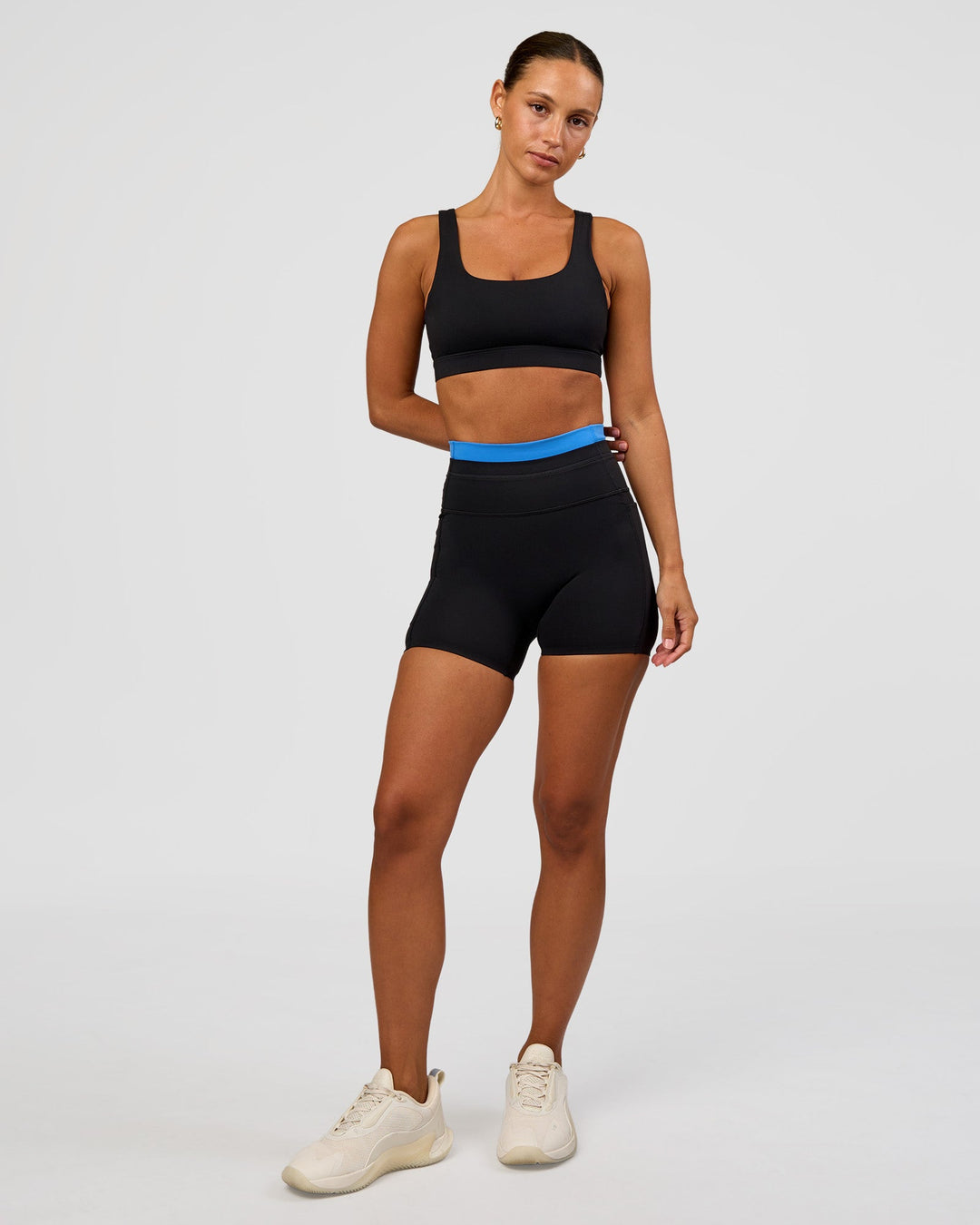 Woman wearing Liberate High-Rise 4" Short Pockets - Black-Palace Blue | Model:Brylee | Size:XS