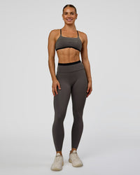 Woman wearing Liberate Sports Bra in Duskstone-Black | Model:Maja | Size:XS