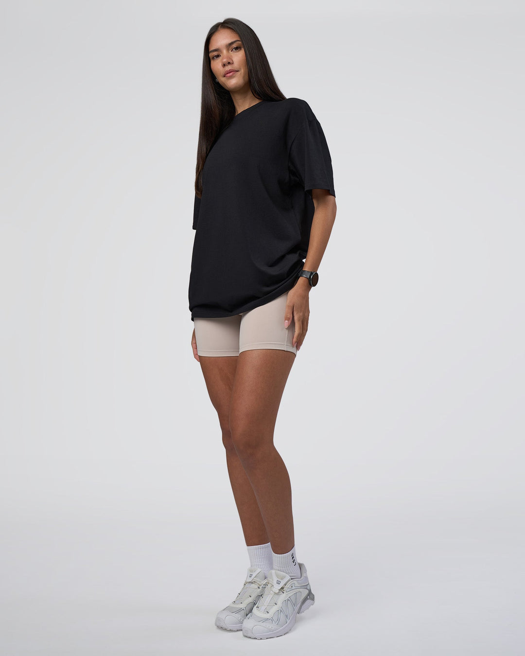 Woman wearing Lifting Club FLXCotton Tee Oversize - Black-Black | Model:Rhiley | Size:XS