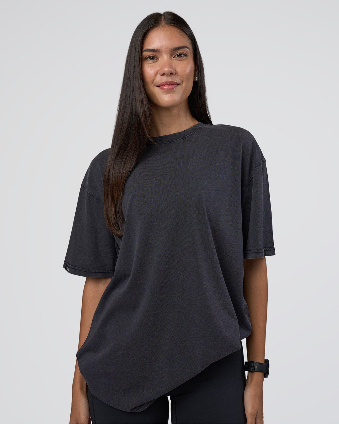 Woman wearing Lifting Club FLXCotton Tee Oversize - Black Washed | Model:Rhiley | Size:XS