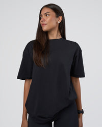 Woman wearing Lifting Club FLXCotton Tee Oversize - Black-White-Red | Model:Rhiley | Size:XS