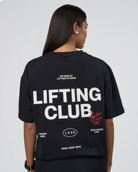 Woman wearing Lifting Club FLXCotton Tee Oversize - Black-White-Red | Model:Rhiley | Size:XS