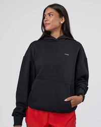 Woman wearing Lifting Unisex Oversized Hoodie - Black-Flame| Model:Rhiley | Size:XS