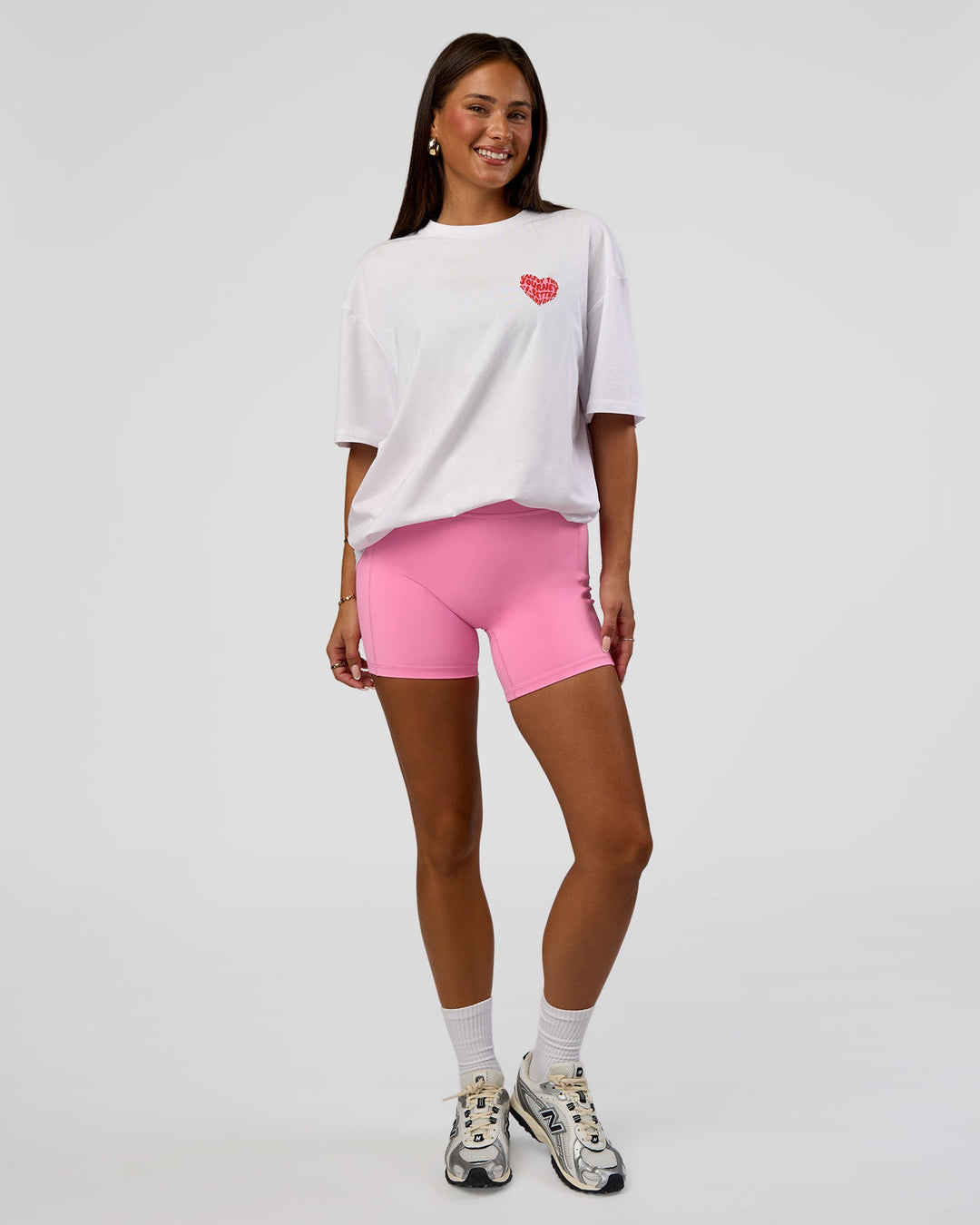 Woman wearing Love the Journey FLXCotton Oversized Tee - White-Candy Pink | Model:Bianca | Size:XS