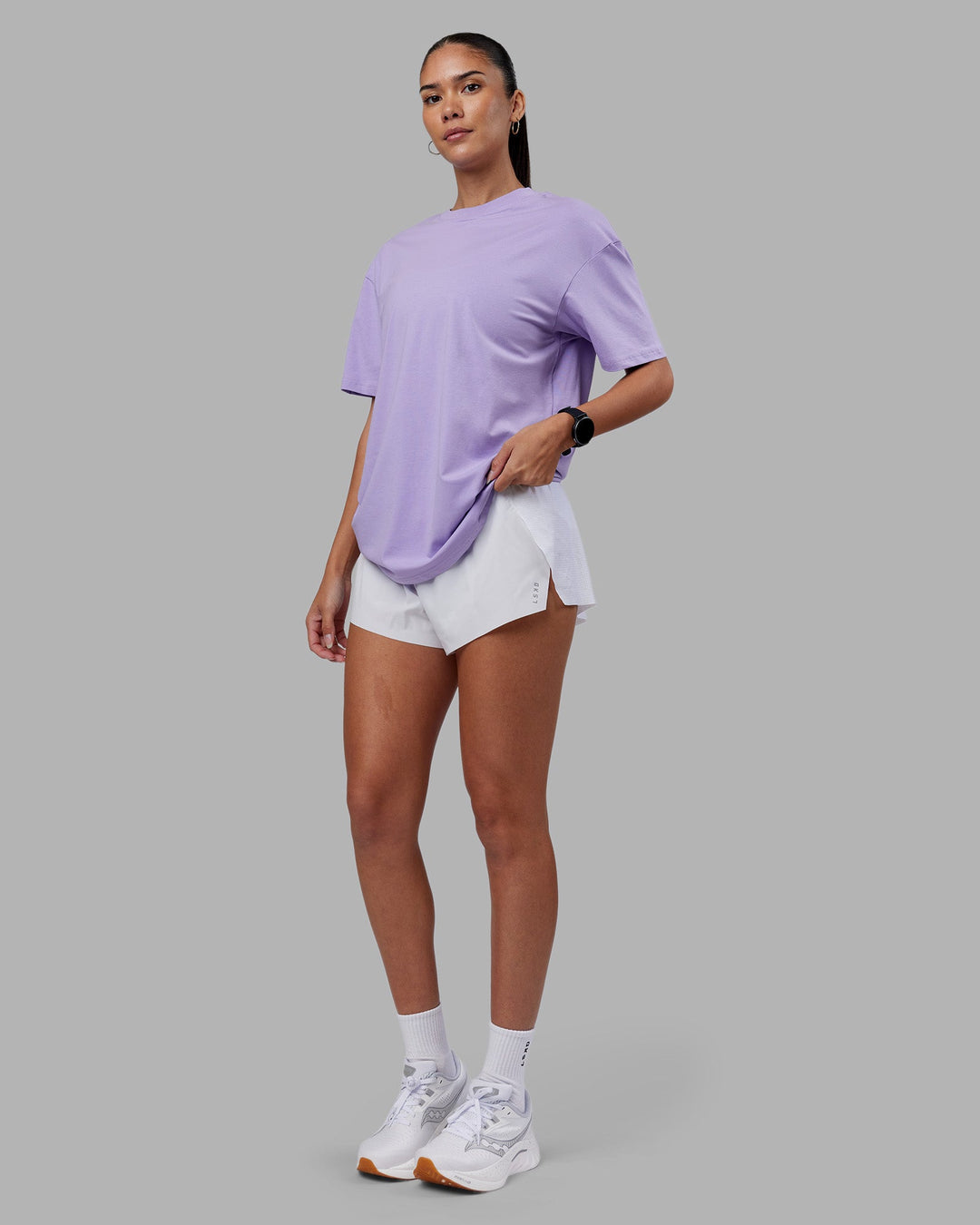 Woman wearing Love The Run FLXCotton Tee Oversize - Violet Ray-Royal Purple | Model:Rhiley | Size:XS