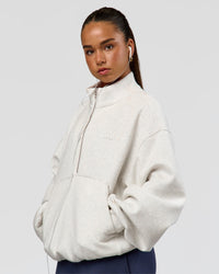 Woman wearing Luxe ZeroCrease Spacer Half Zip - Silver Marl | Model:Sophia | Size:XS