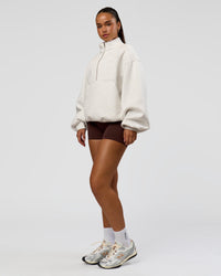 Woman wearing Luxe ZeroCrease Spacer Half Zip - Silver Marl | Model:Sophia | Size:XS