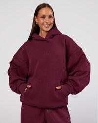 Woman wearing MVP Oversized Hoodie - Cherry Lacquer | Model:Brylee | Size:XS