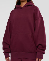 Woman wearing MVP Oversized Hoodie - Cherry Lacquer | Model:Brylee | Size:XS