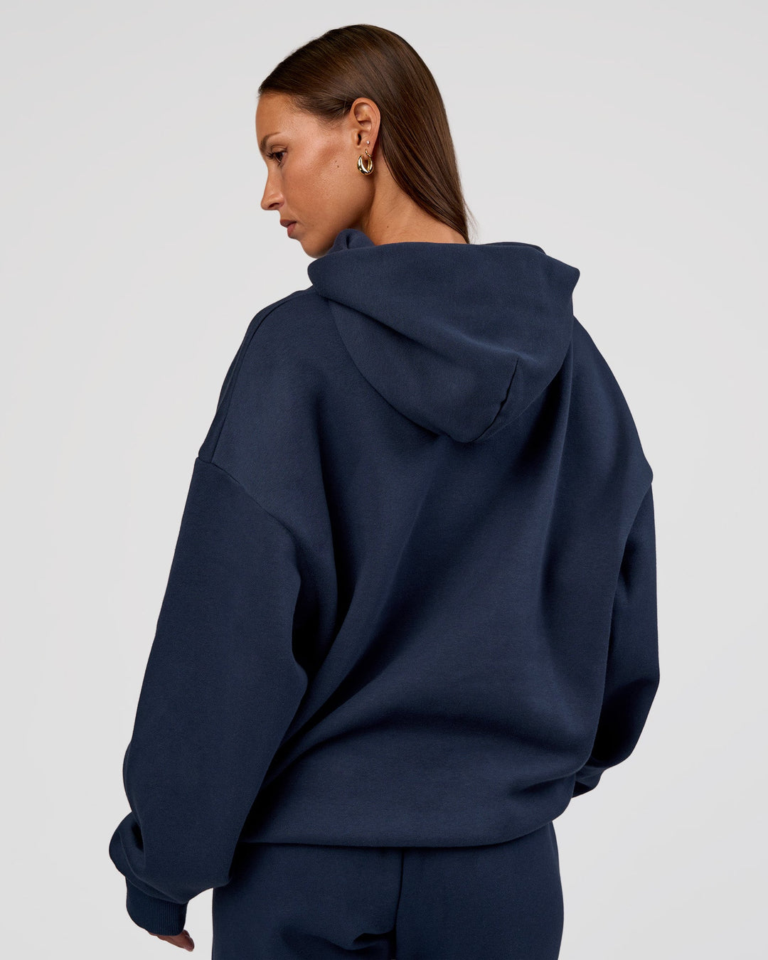 Woman wearing MVP Oversized Hoodie - Future Navy | Model:Brylee | Size:XS