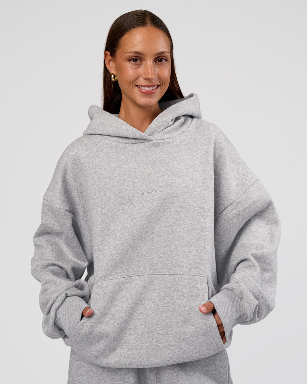 Woman wearing MVP Oversized Hoodie - Light Grey Marl | Model:Brylee | Size:XS