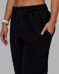 Woman wearing MVP Quilted Track Pant - Black-Geometric | Model:Lyss | SIze:XS