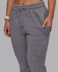 Woman wearing MVP Quilted Track Pant - Storm Front-Geometric | Model:Lyss | Size:XS
