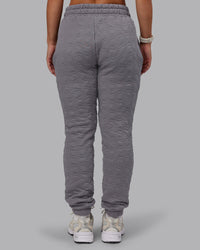 Woman wearing MVP Quilted Track Pant - Storm Front-Geometric | Model:Lyss | Size:XS