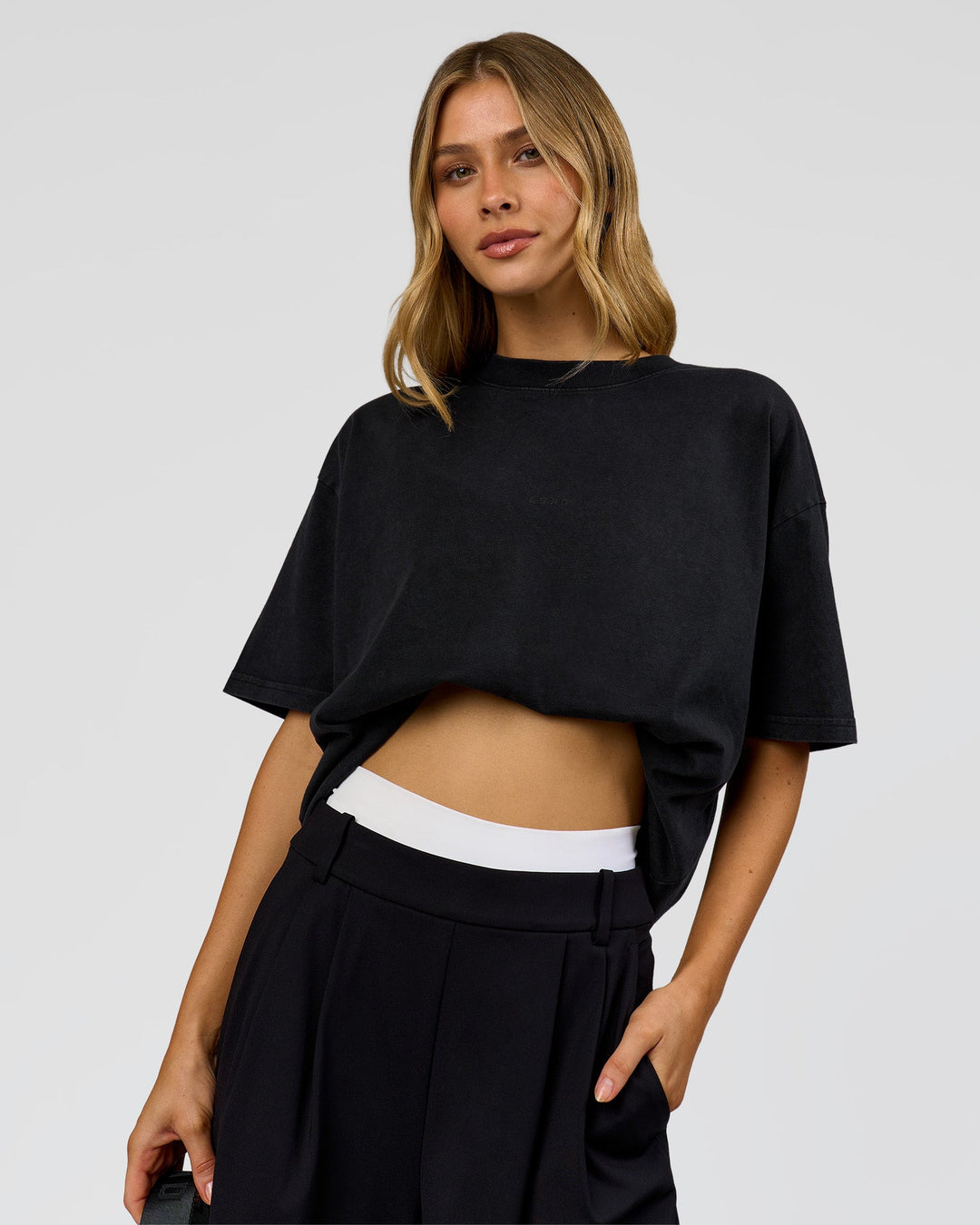 Woman wearing Memory in Motion Heavyweight Oversized Tee - Black Washed | Model:Leilani | Size:XS