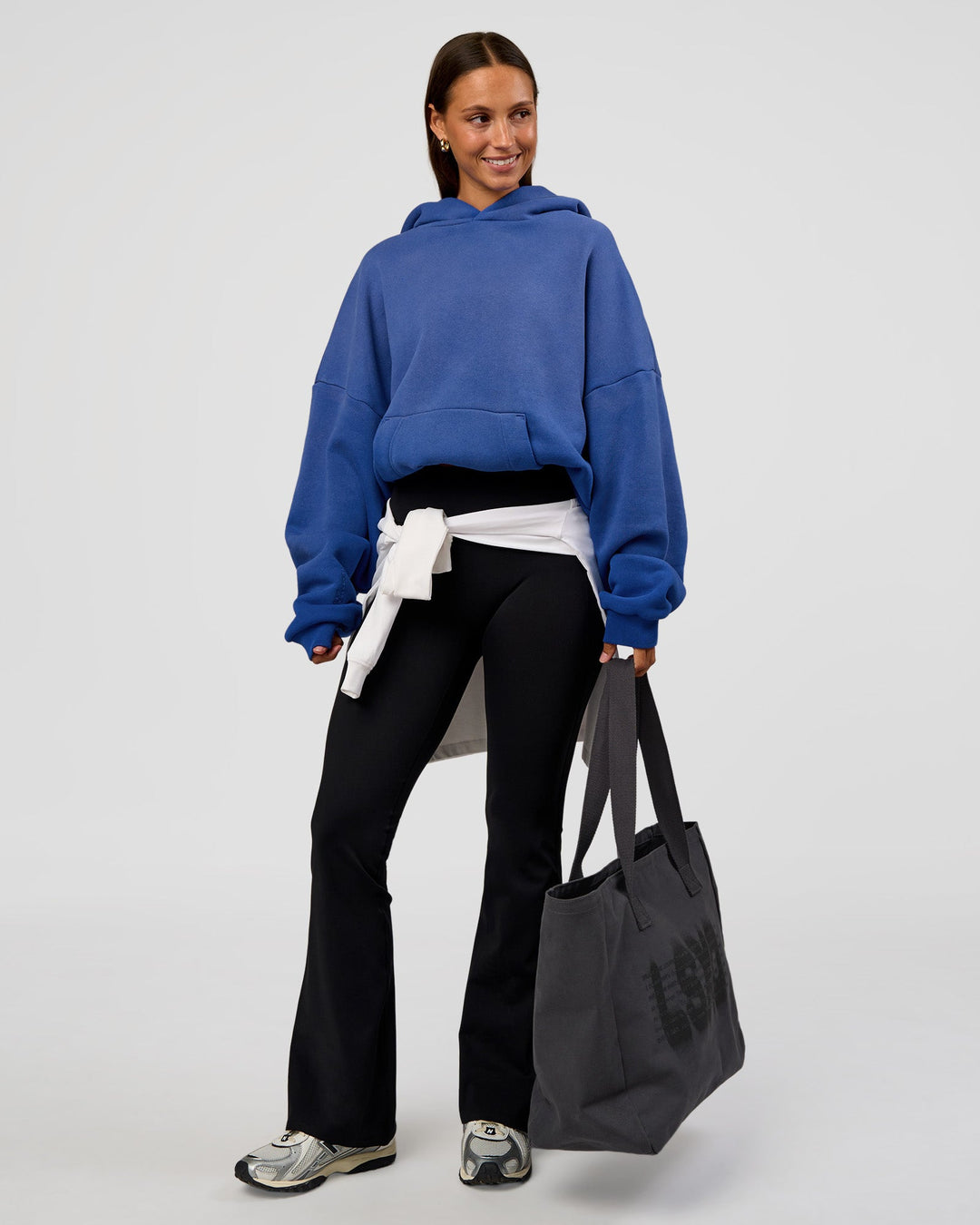 Woman wearing Memory In Motion Ultra Heavyweight Washed Hoodie - Electric Indigo Washed | Model:Brylee | Size:XS