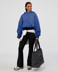 Woman wearing Memory In Motion Ultra Heavyweight Washed Hoodie - Electric Indigo Washed | Model:Brylee | Size:XS
