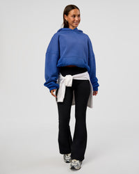 Woman wearing Memory In Motion Ultra Heavyweight Washed Hoodie - Electric Indigo Washed | Model:Brylee | Size:XS