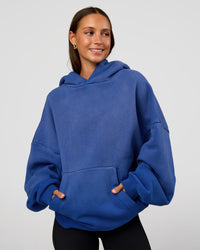Woman wearing Memory In Motion Ultra Heavyweight Washed Hoodie - Electric Indigo Washed | Model:Brylee | Size:XS