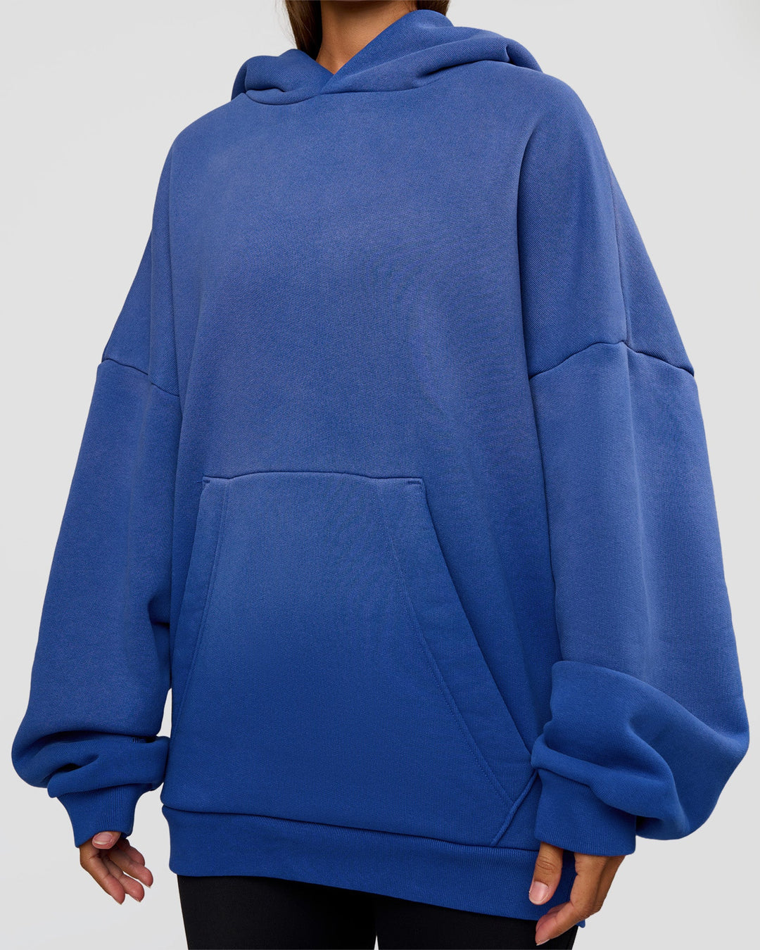 Woman wearing Memory In Motion Ultra Heavyweight Washed Hoodie - Electric Indigo Washed | Model:Brylee | Size:XS