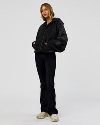 Woman wearing Memory in Motion Ultra Heavyweight Zip Thru Hoodie - Black Washed | Model:Leilani | Size:XS