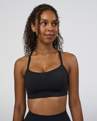 Woman wearing Momentum Sports Bra D/DD/E - Black | Model:Jordan | Size:XS