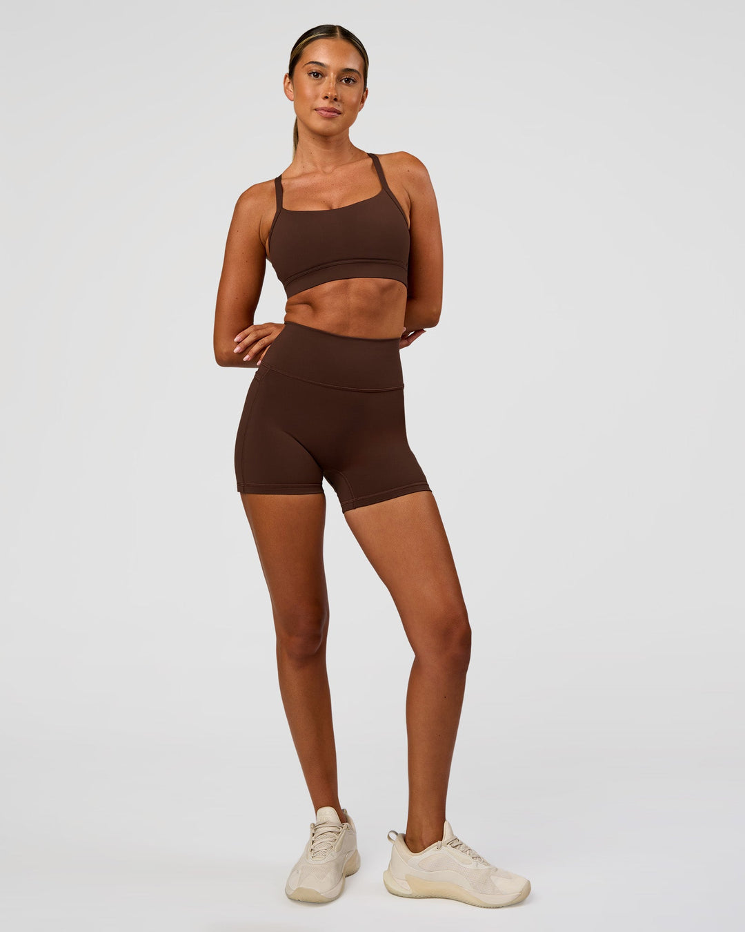Woman wearing Momentum Sports Bra - Hot Chocolate | Model:Charli | Size:XS - view 6