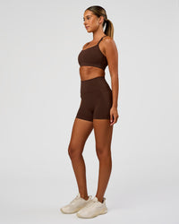 Woman wearing Momentum Sports Bra - Hot Chocolate | Model:Charli | Size:XS | Thumbnail Index: 6
