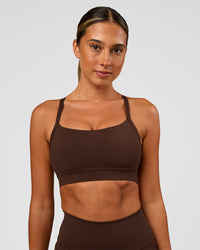 Woman wearing Momentum Sports Bra - Hot Chocolate | Model:Charli | Size:XS | Thumbnail Index: 0