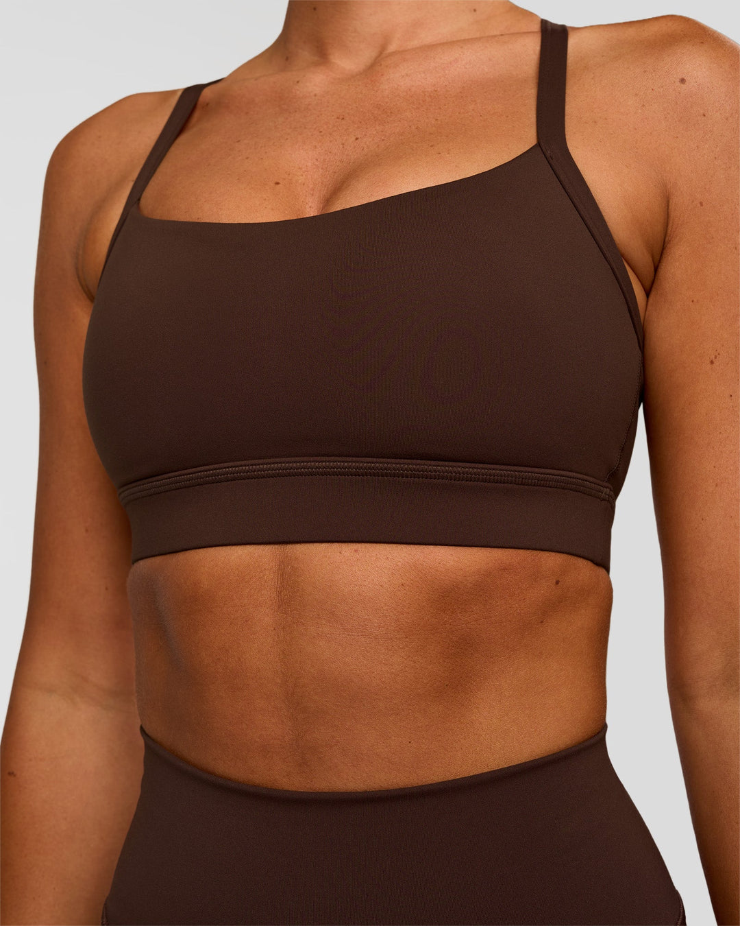 Woman wearing Momentum Sports Bra - Hot Chocolate | Model:Charli | Size:XS - view 4
