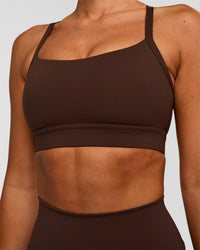 Woman wearing Momentum Sports Bra - Hot Chocolate | Model:Charli | Size:XS | Thumbnail Index: 3